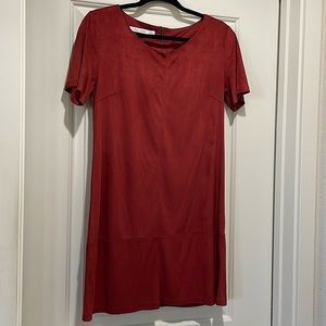 Bishop and Young Dress. Mid length in a deep burnt orange red color